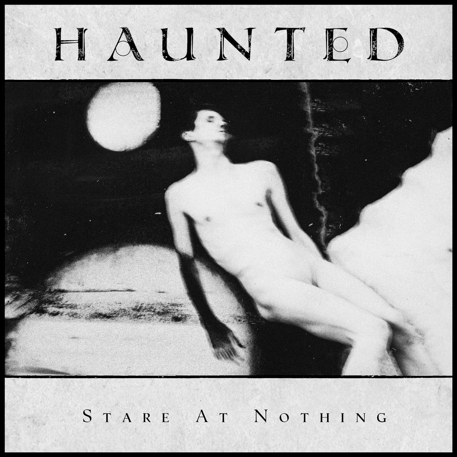 Das Bild zeigt das Albumcover von Haunted - Stare At Nothing